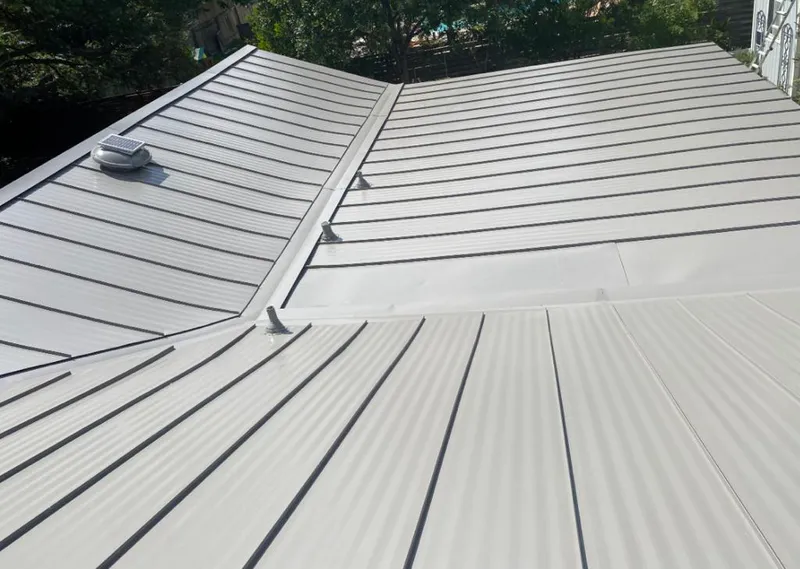 Solar attic fan installed on a metal roof for Roof Ventilation in Tuscaloosa